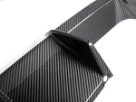 A close up view of AUTOTECKNIC DRY CARBON MOTORSPORT REAR DIFFUSER - BMW G80 M3 | G82/ G83 M4 2021+ with white background