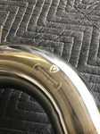 A close view of Valvetronic Designs Free Flow Race Front Pipe, showing the brand's logo, on a grey carpet (for Mclaren 540C/570/600LT).