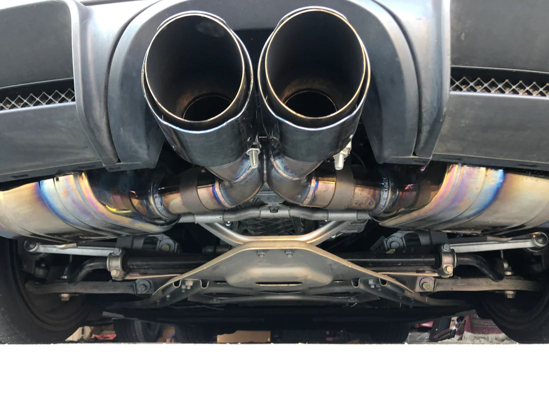 A close view of Valvetronic Designs Valved Sport Exhaust System fitted on a car (for Porsche Boxster/Cayman 981).