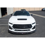 A front view of a white car fitted with APR Performance Front Wind Splitter Ford Mustang S650 2024+ on the car