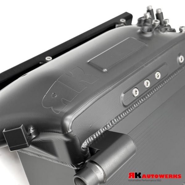 A close up view of Thermal Tungsten Grey of the RK Autowerks S58 BILLET PORT INJECTION MANIFOLD with a white background