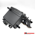 A side view of Thermal Black of the RK Autowerks S58 BILLET PORT INJECTION MANIFOLD with a white background