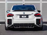 A wide view of AUTOTECKNIC DRY CARBON PERFORMANTE REAR DIFFUSER - BMW G87 M2 2023+ fitted on a car