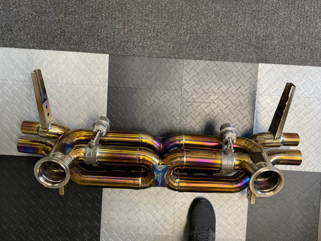 A top view of Valvetronic Designs Valved Sport Exhaust System (for Audi R8 V10 / Lamborghini HuracanF1) on the ground.