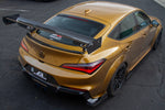 A top wide view of APR Performance GT-250 Carbon Fiber Adjustable Wing for Acura DE5 Integra Type S 2024+ fitted on a golden car from the top on the ground