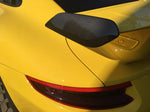 A close up view of TECHART Rear Spoiler Panels Carbon "glossy" for Porsche 991.2 GT3 from MY17 fitted on a yellow car