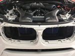 A front wide view of RK Autowerks F85 F86 X5M & X6M CARBON FIBER INTAKES fitted on a car