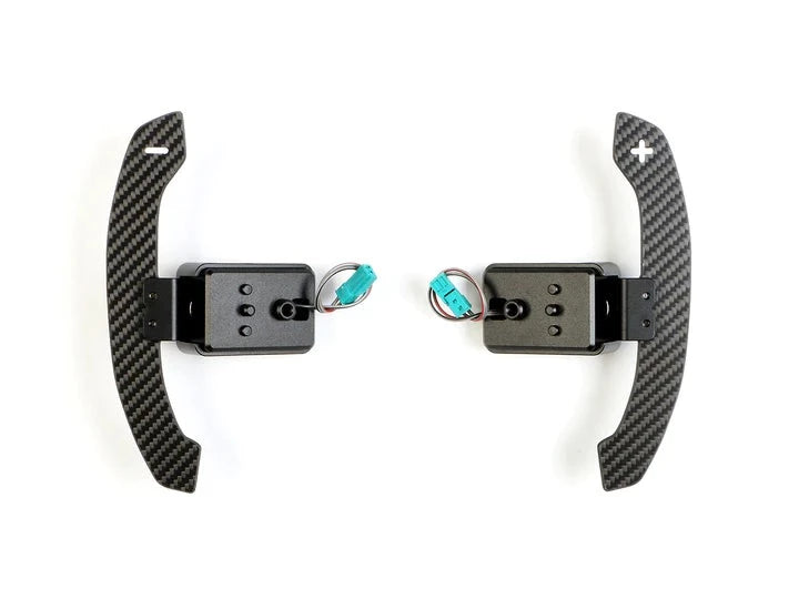 A front view of AUTOTECKNIC MAGNETIC CORSA SHIFT PADDLES - TOYOTA A90 SUPRA 2019+ with white background