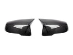 A front view of AUTOTECKNIC M-INSPIRED CARBON FIBER MIRROR COVERS - BMW F06/ F12/ F13 6-SERIES 2014-2016 with white background