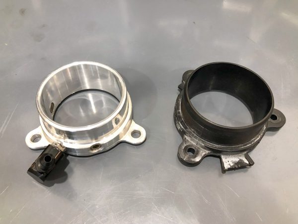 A top view of RK Autowerks F90 F92 M5 M8 BILLET METHANOL NOZZLE ADAPTERS on a table