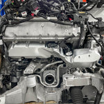 A wide view of RK Autowerks F9X M5 M8 BILLET INTAKE MANIFOLDS fitted on a car