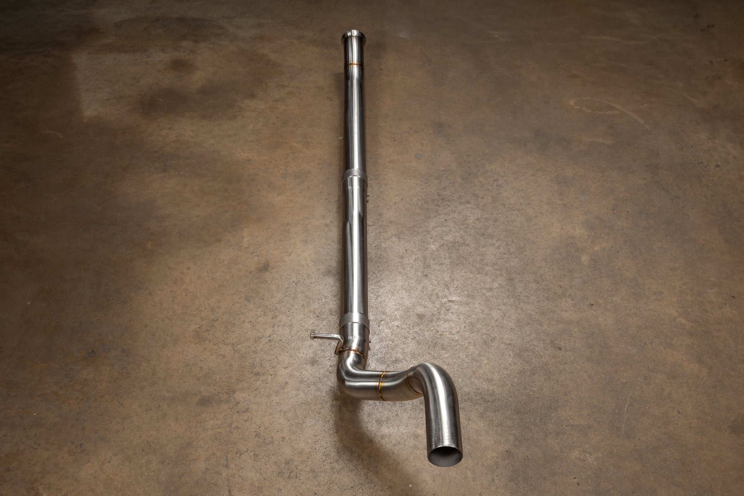 Valvetronic Designs Blackbear Exhaust Jeep Wrangler JL / JLU manufacturer gallery: long polished pipe viewed vertically with its end bend visible