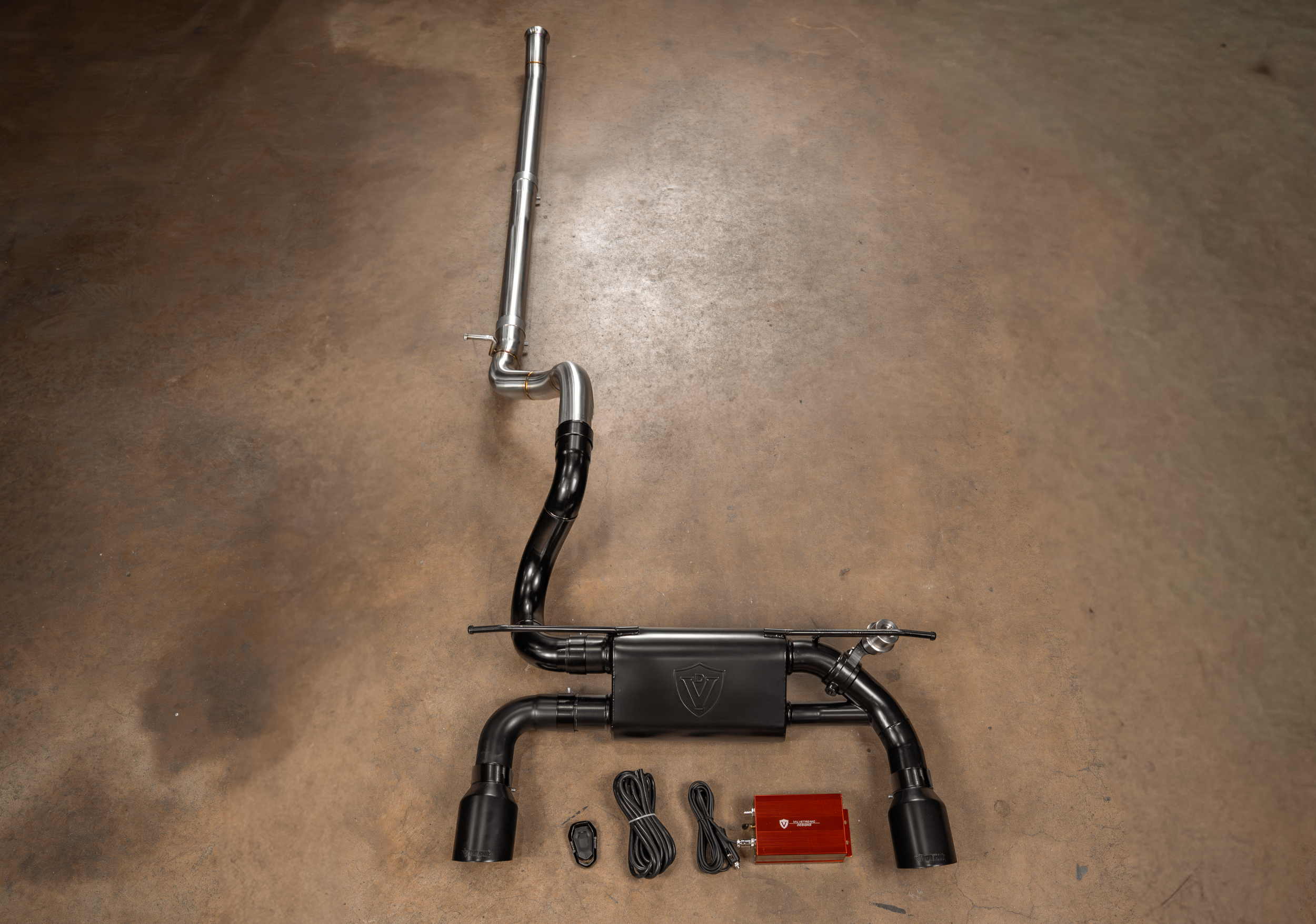 Valvetronic Designs Blackbear Exhaust Jeep Wrangler JL / JLU manufacturer gallery: long front pipe above the black rear muffler and control kit