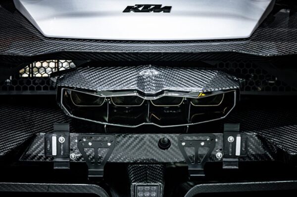 wide view of Capristo Valved Exhaust with Heat Shield and Carbon/Stainless Exhaust Finisher for KTM X-Bow GT-XR 2008-2019 fitted inside a car