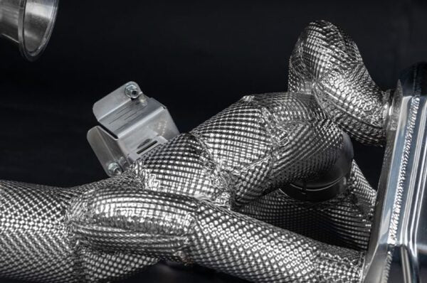 close view of Capristo Valved Exhaust with Heat Shield and Carbon/Stainless Exhaust Finisher for KTM X-Bow GT-XR 2008-2019 fitted inside a car