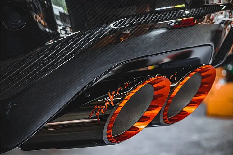 close view of Capristo Valved Exhaust with Middle Silencer Spare and Wicrom “Performante” Tips (for OE Actuators) for Lamborghini Urus Performante 2023-2025 fitted inside a car