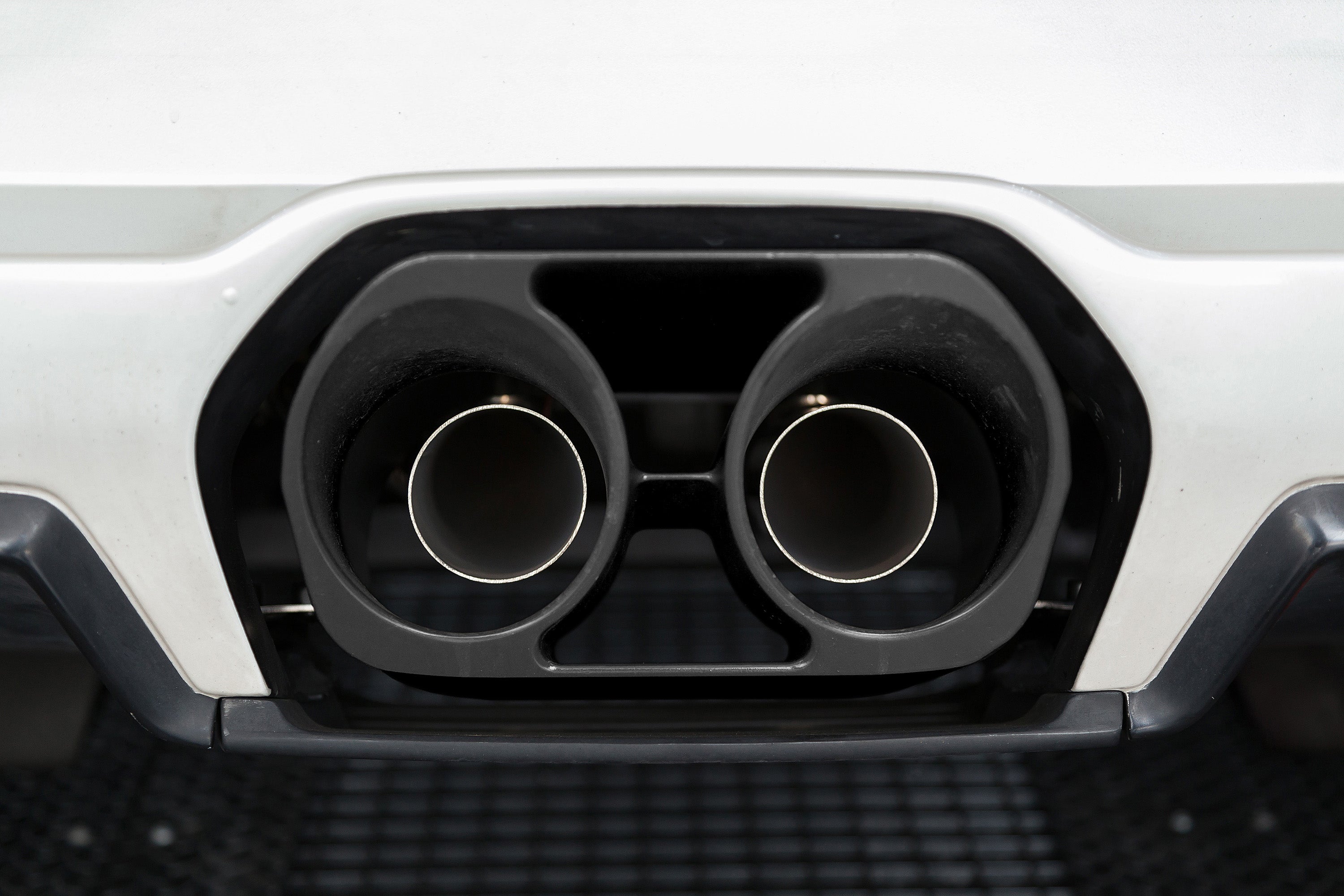 Close-up of twin round tips in black surround on Lamborghini Murcielago LP640 with Capristo exhaust
