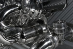 Close-up of Capristo LP640 header collectors, valve actuator and polished stainless tubing