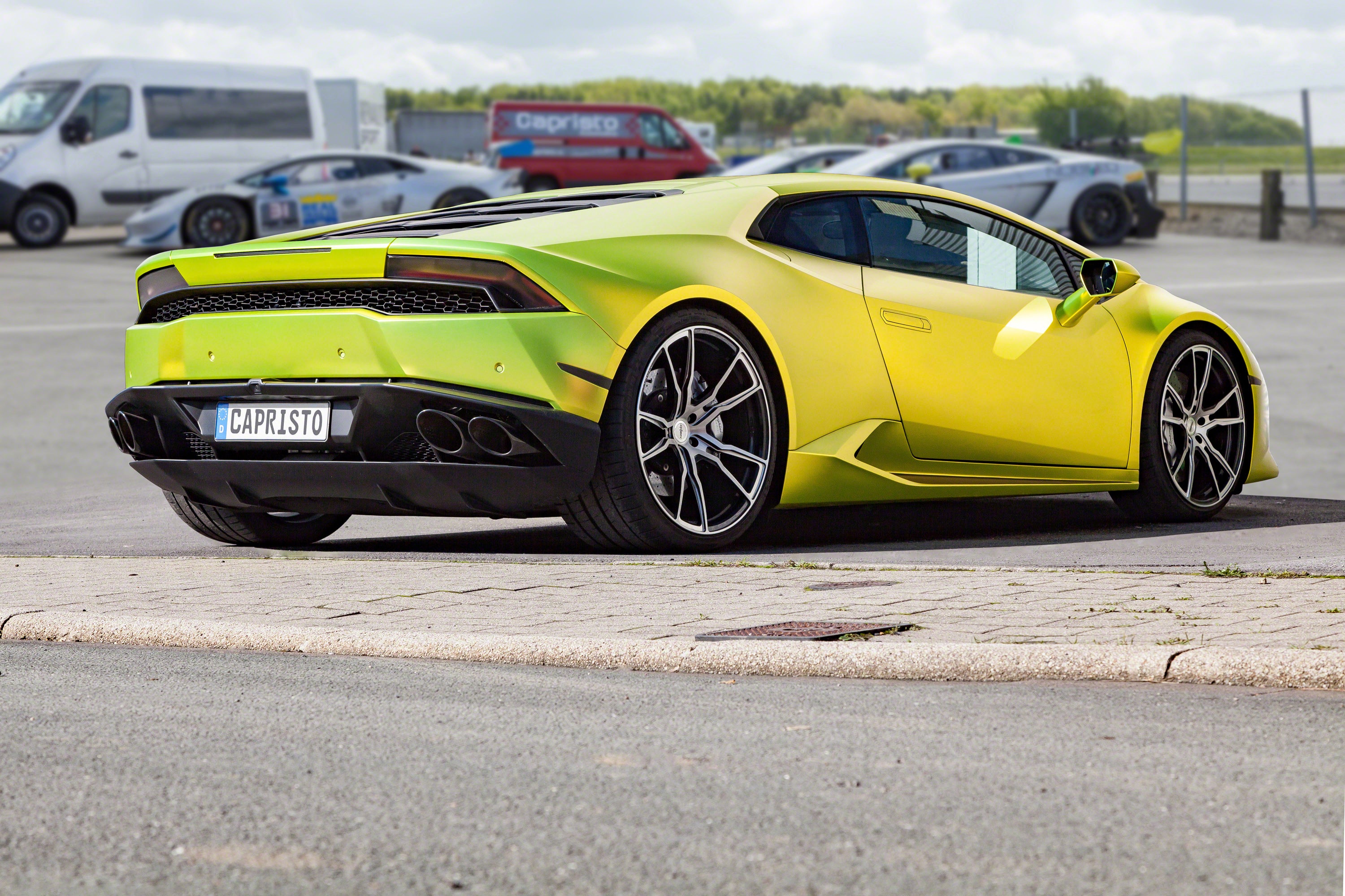 Lime green Lamborghini Huracan rear three-quarter fitted with Capristo valved exhaust