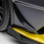 A side close up view of a car fitted with Vorsteiner Aero Canards Carbon Fiber for Lamborghini Huracan STO 2021-2025 on a white background