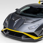 A side wide view of a car fitted with Vorsteiner Aero Hood Ducts Carbon Fiber for Lamborghini Huracan STO 2021-2025 on a white background