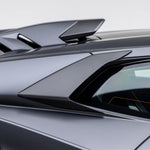 A side close up view of a car fitted with Vorsteiner Aero Side Intakes Carbon Fiber for Lamborghini Huracan STO 2021-2025 with white background