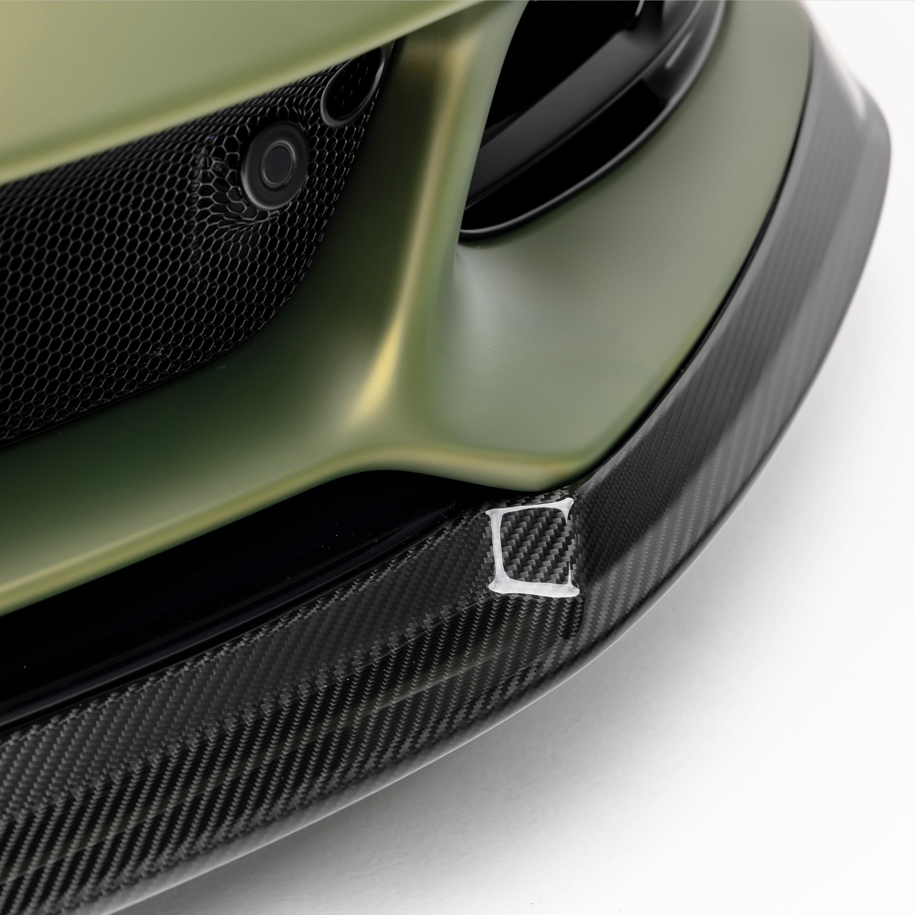 Emira front spoiler corner with carbon endplate, close-up