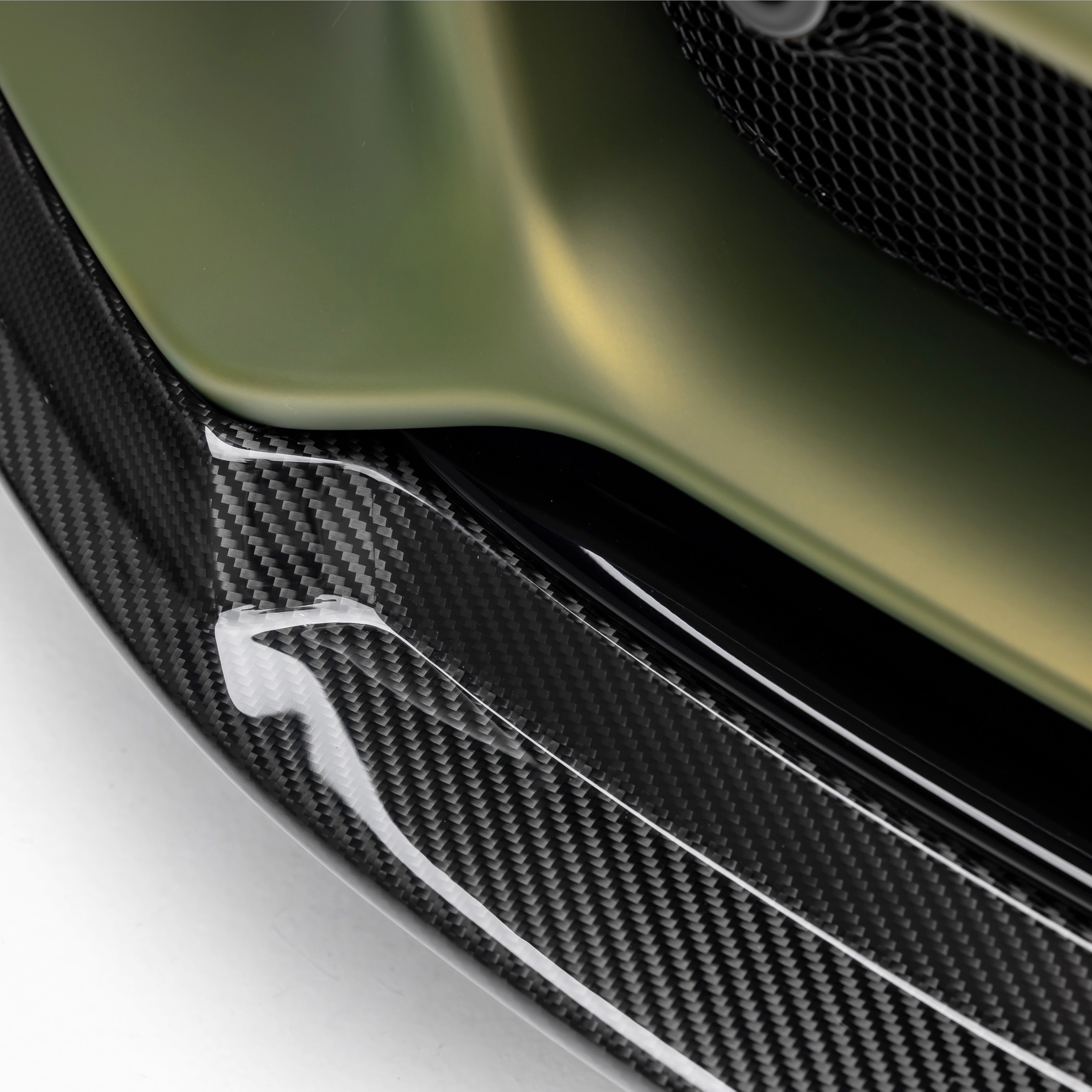 Gloss carbon Emira front spoiler edge, macro angled view