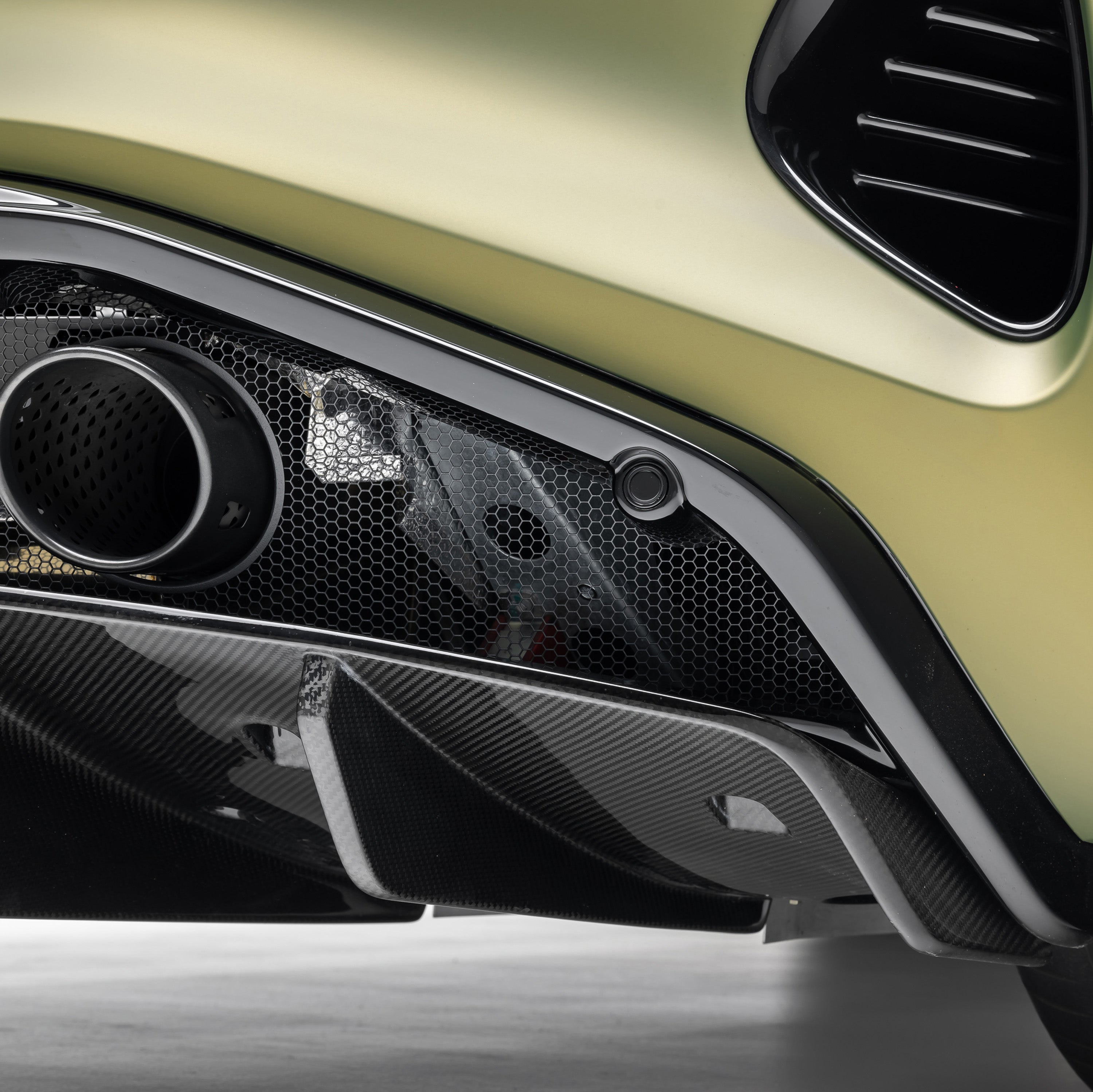 Emira diffuser side and exhaust tip, angled detail