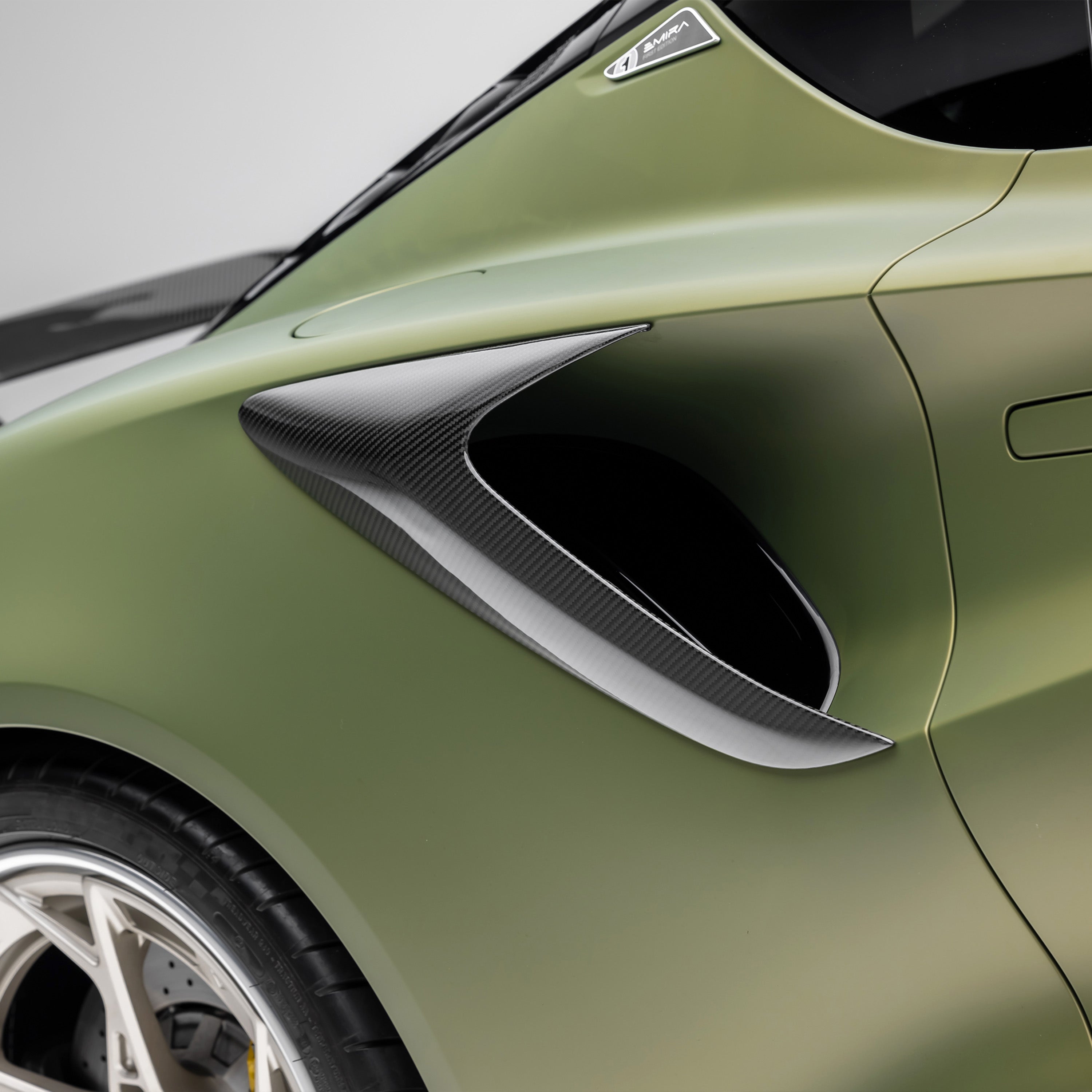 Emira side intake and rear wheel, low side view