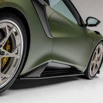 Carbon side skirt on green Lotus Emira, front 3/4 close-up