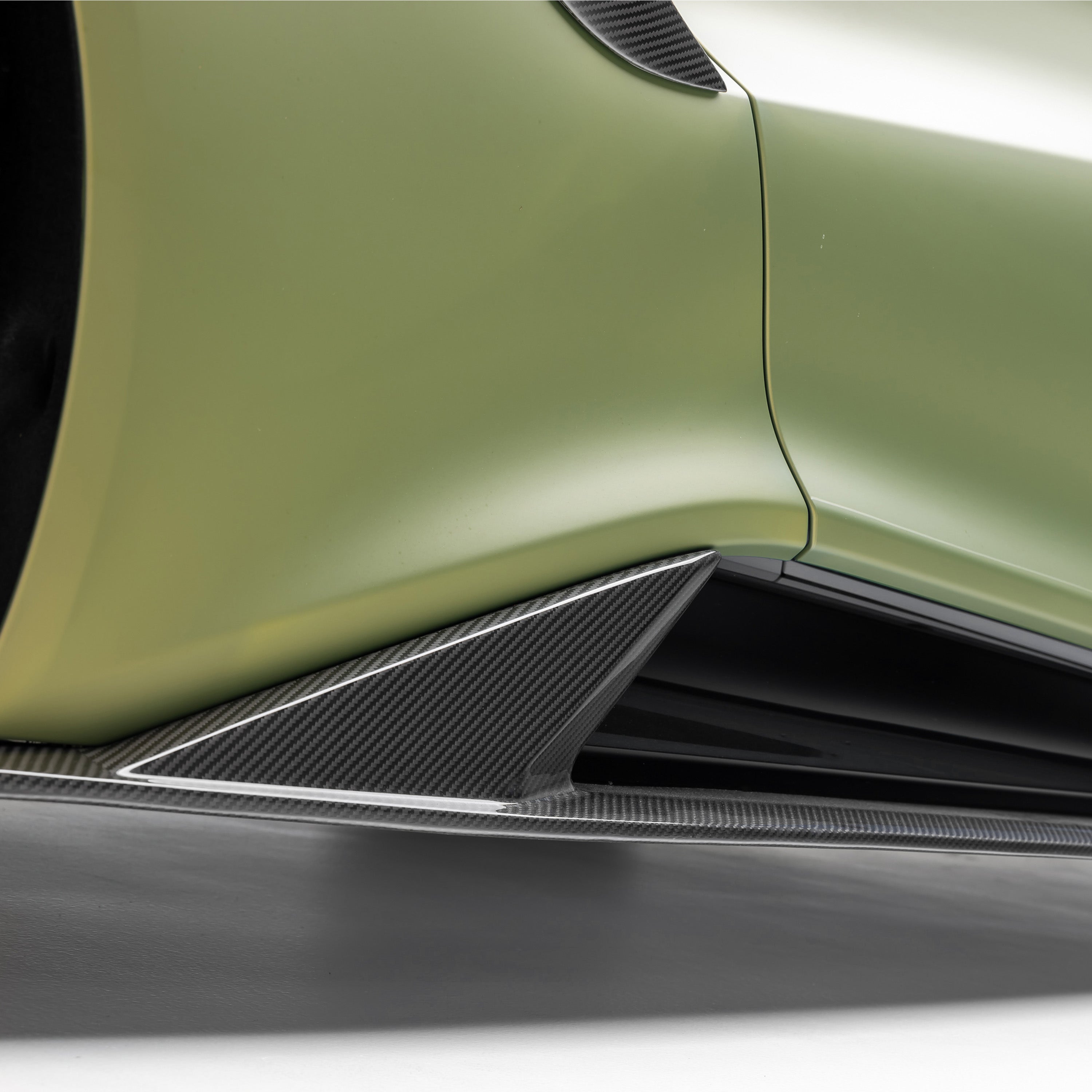 Carbon side skirt fin ahead of Emira rear wheel, detail