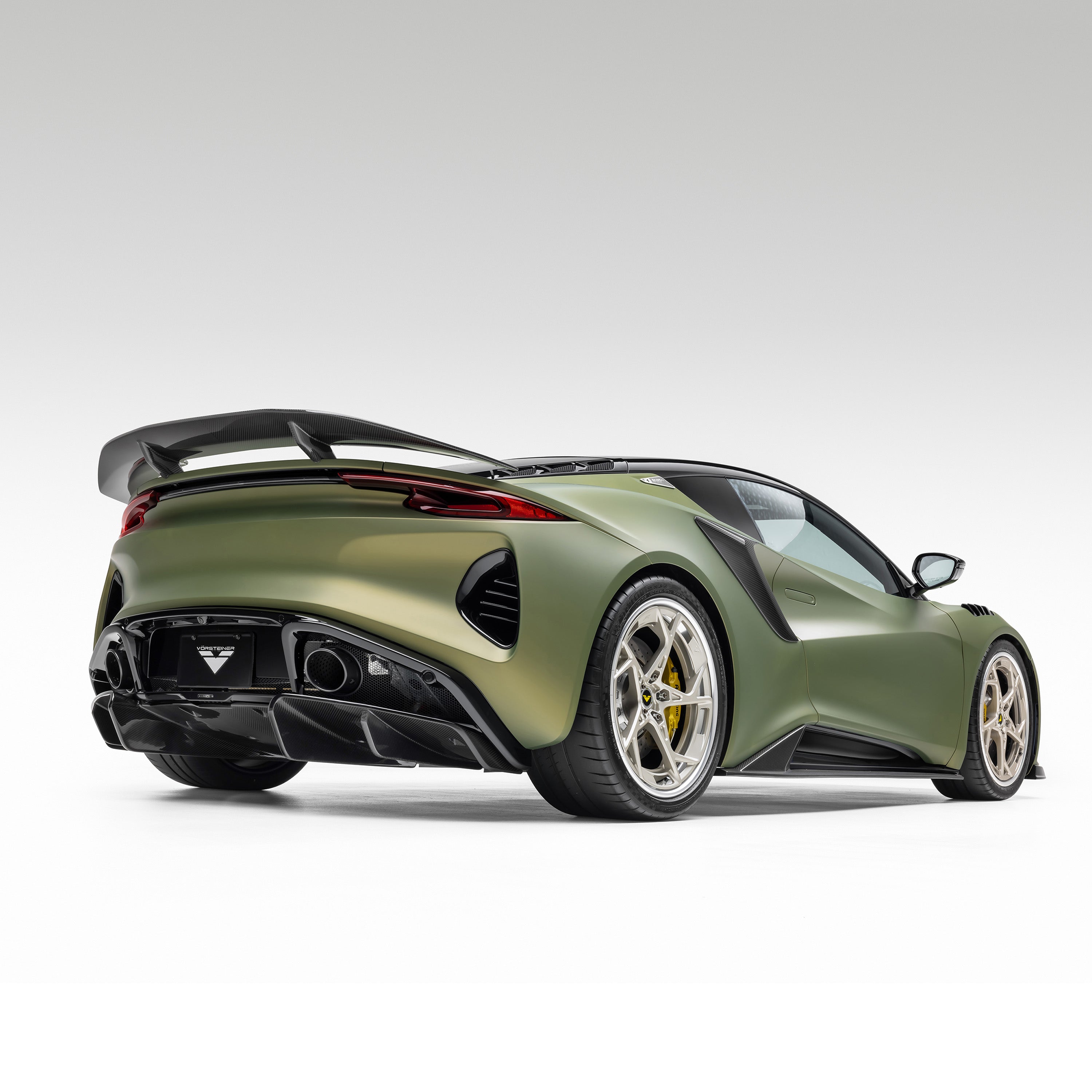 Emira with Vorsteiner aero and side skirts, rear 3/4 view