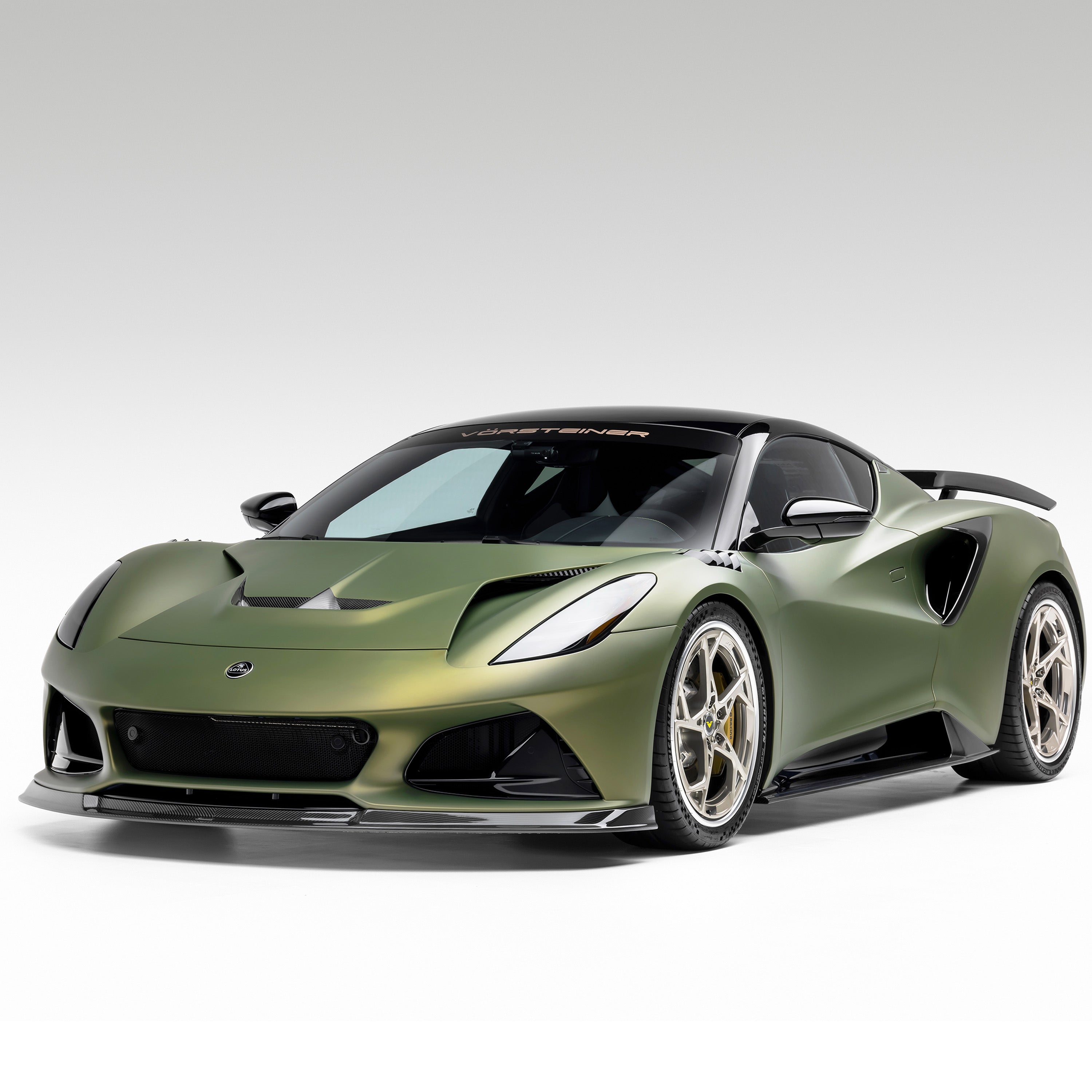 Green Emira with LR-52 vented fenders, front 3/4 view of car