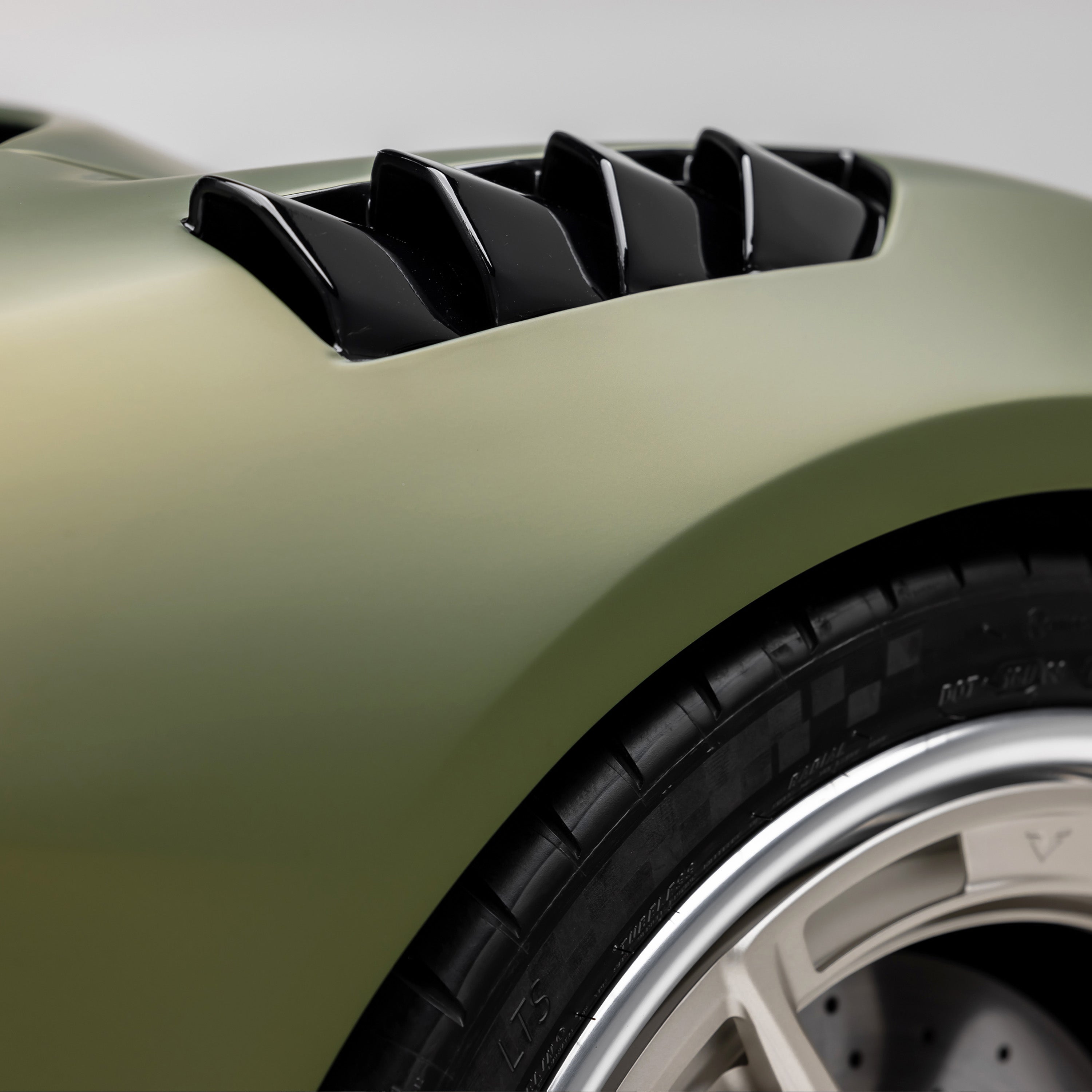 Carbon louvers on Emira fender, low angled view