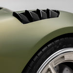 Carbon louvers on Emira fender, low angled view