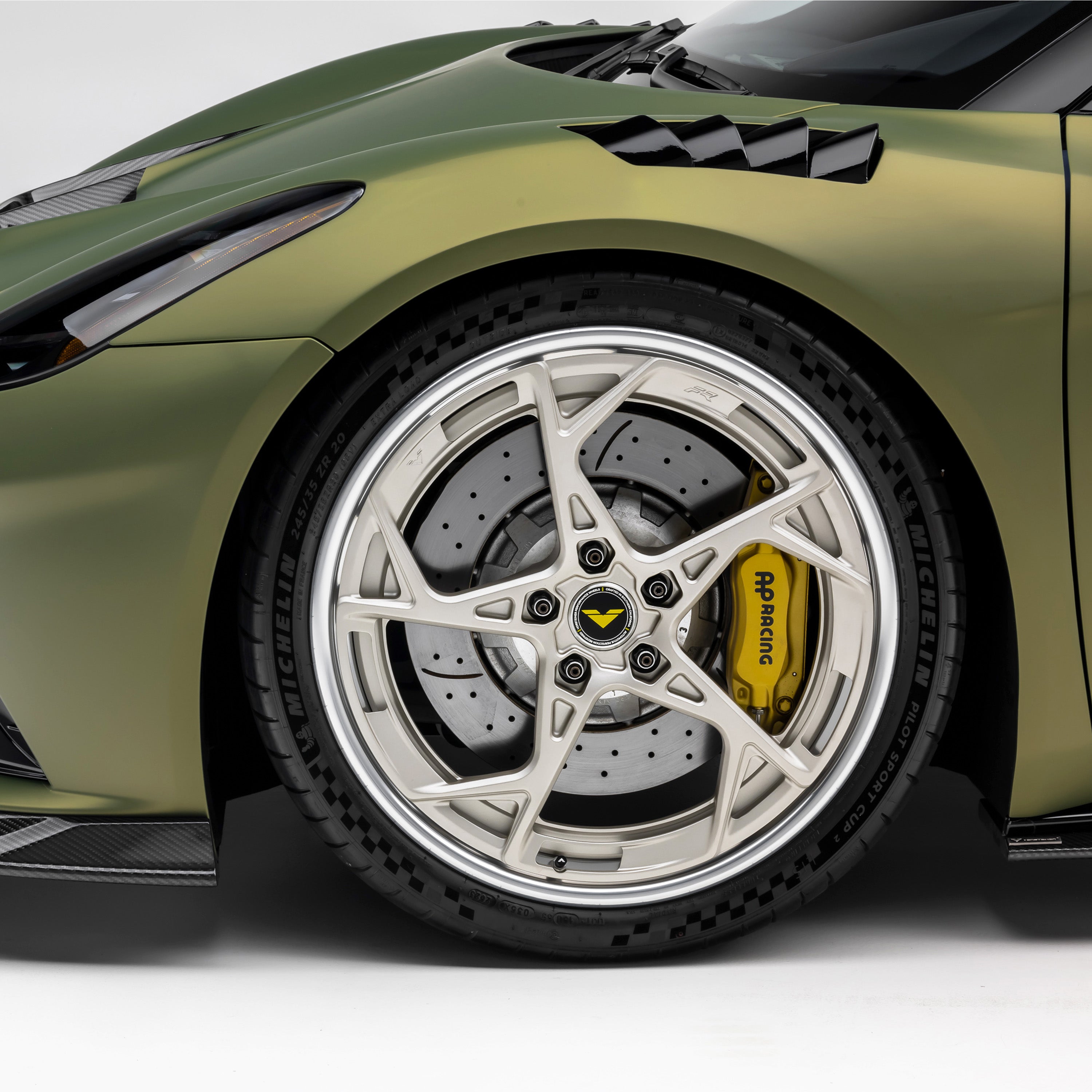 Lotus Emira front wheel and vented fender, side 3/4 view