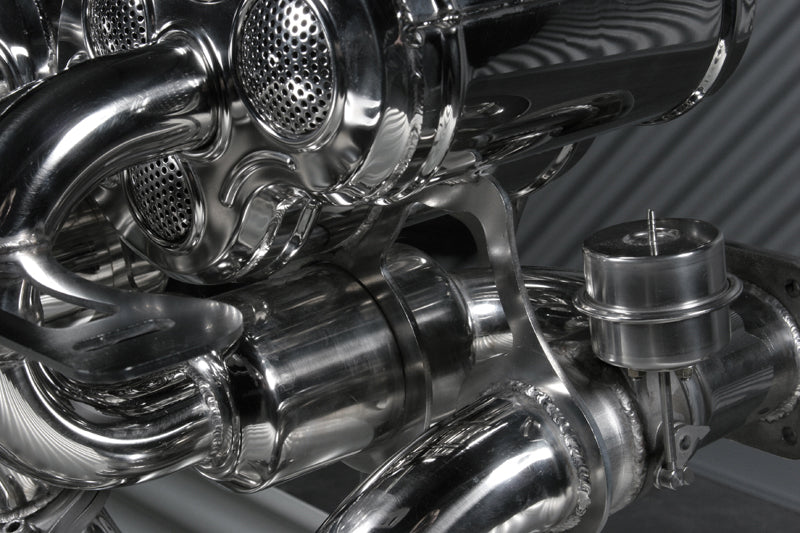 Close-up of valve actuator and perforated muffler outlets on Capristo Murcielago exhaust