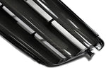 A close up view of AUTOTECKNIC REPLACEMENT CARBON FIBER FRONT GRILLE - MERCEDES BENZ W204 C-CLASS SEDAN 2008-2012 with white background