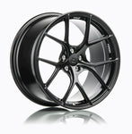 A side view of 7 T-S5 Forged Split 5 Spoke Exotic Wheels in Machine Black for PORSCHE 19" BOXSTER CAYMAN (987 981 718) 2005+
