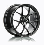 A side view of 7 T-S5 Forged Split 5 Spoke Exotic Wheels in Machine Black for PORSCHE CAYMAN GT4 981 718 2015+
