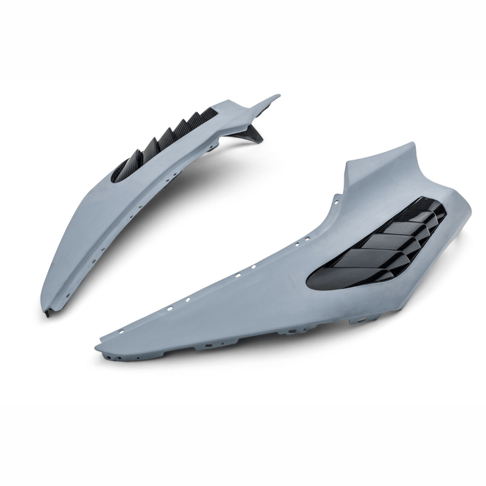 A top view of Vorsteiner Silverstone Edition Glossy Carbon Fiber PP 2x2 Aero Front Fenders w/ Integrated Vents McLaren 720S 2017+ with white background