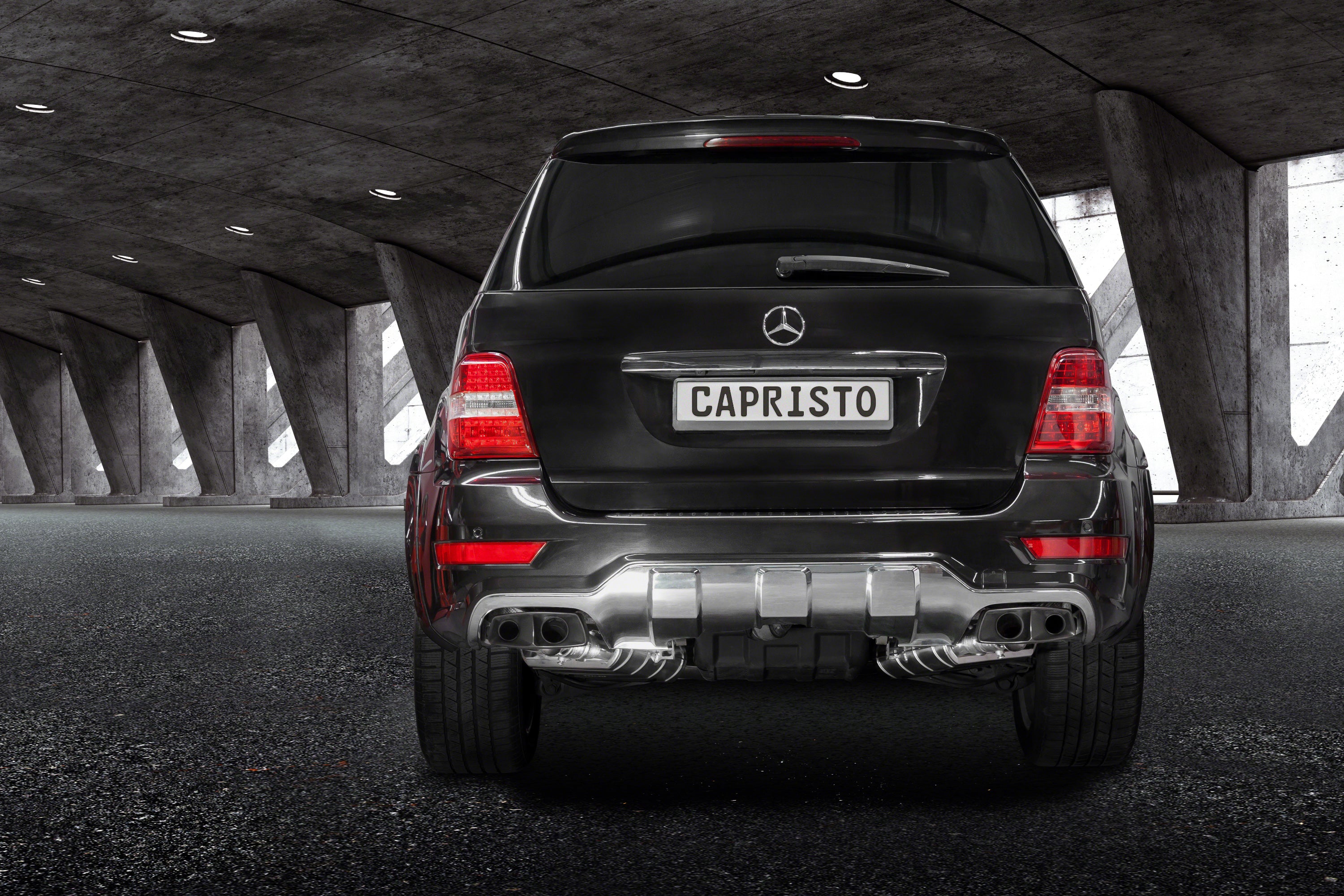 Black Mercedes-AMG ML63 W164 rear view with Capristo valved mufflers and ceramic tips