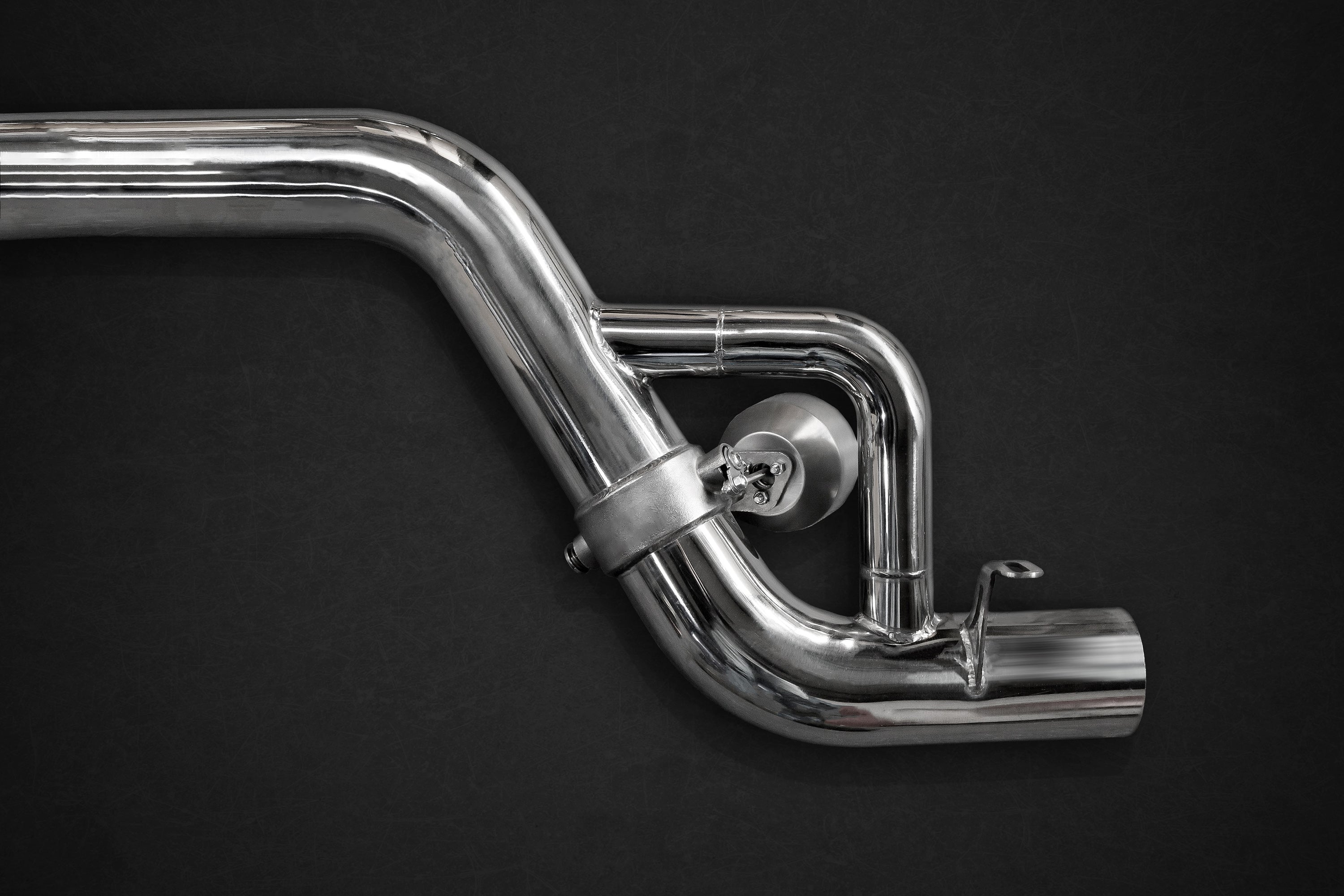 Close-up of Capristo AMG GT valved muffler section with valve and polished round tips
