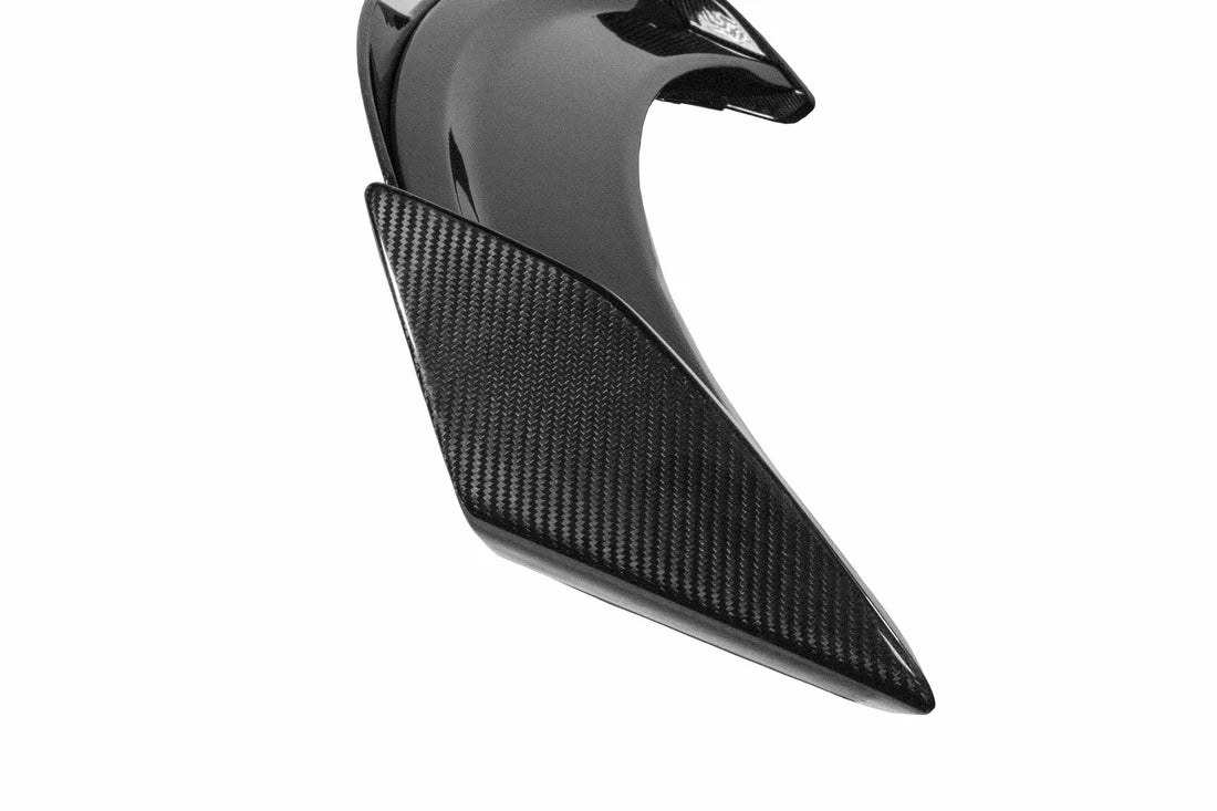 A close up view from the top of APR Performance Carbon Fiber Spoiler with Gurney for Ford Mustang S650 Dark Horse 2024+ with white background