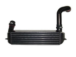 A front view of the intercooler of Evolution Racewerks Competition Series Front Mount Intercooler (FMIC) Kit for BMW N54/N55 135i/335i/1M in Type III Hard Anodize Black Finish
