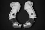 wide view of Capristo 100 Cell Sports Cat Downpipes (with Heat Blankets) for Aston Martin V12 Vantage AE31 2022+ with black background