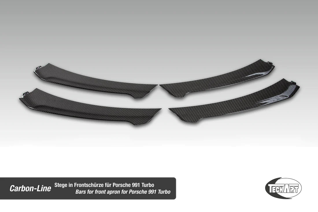 A top view of TECHART Carbon Grille Trim Bar, "glossy" for Porsche 991.1 Turbo S up to MY16 with a light grey background