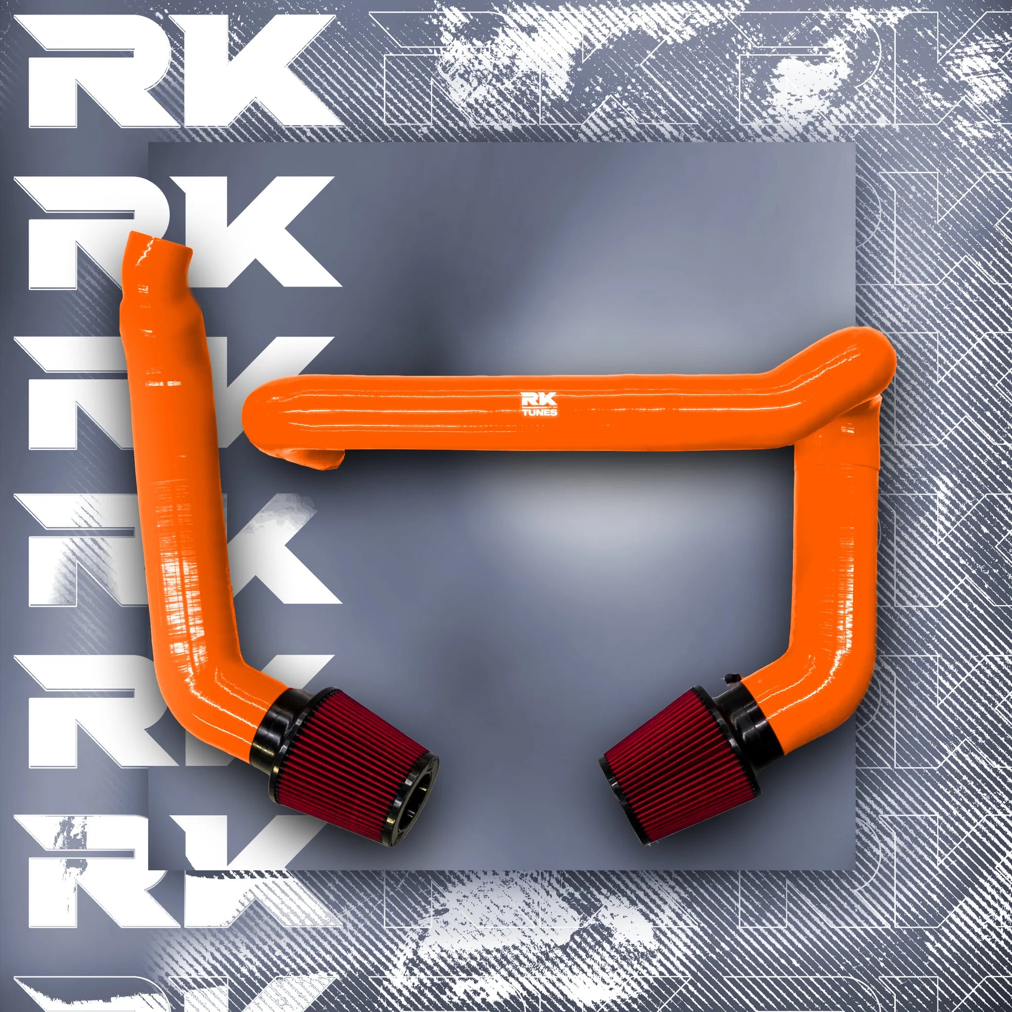 A top view of RK TUNES FRONT MOUNT INTAKES FOR G80 | G82 | G83 | G87 M2 | M3 | M4 | S58 2020+ in orange with red air filters