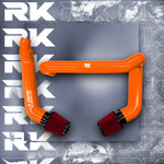 A top view of RK TUNES FRONT MOUNT INTAKES FOR G80 | G82 | G83 | G87 M2 | M3 | M4 | S58 2020+ in orange with red air filters